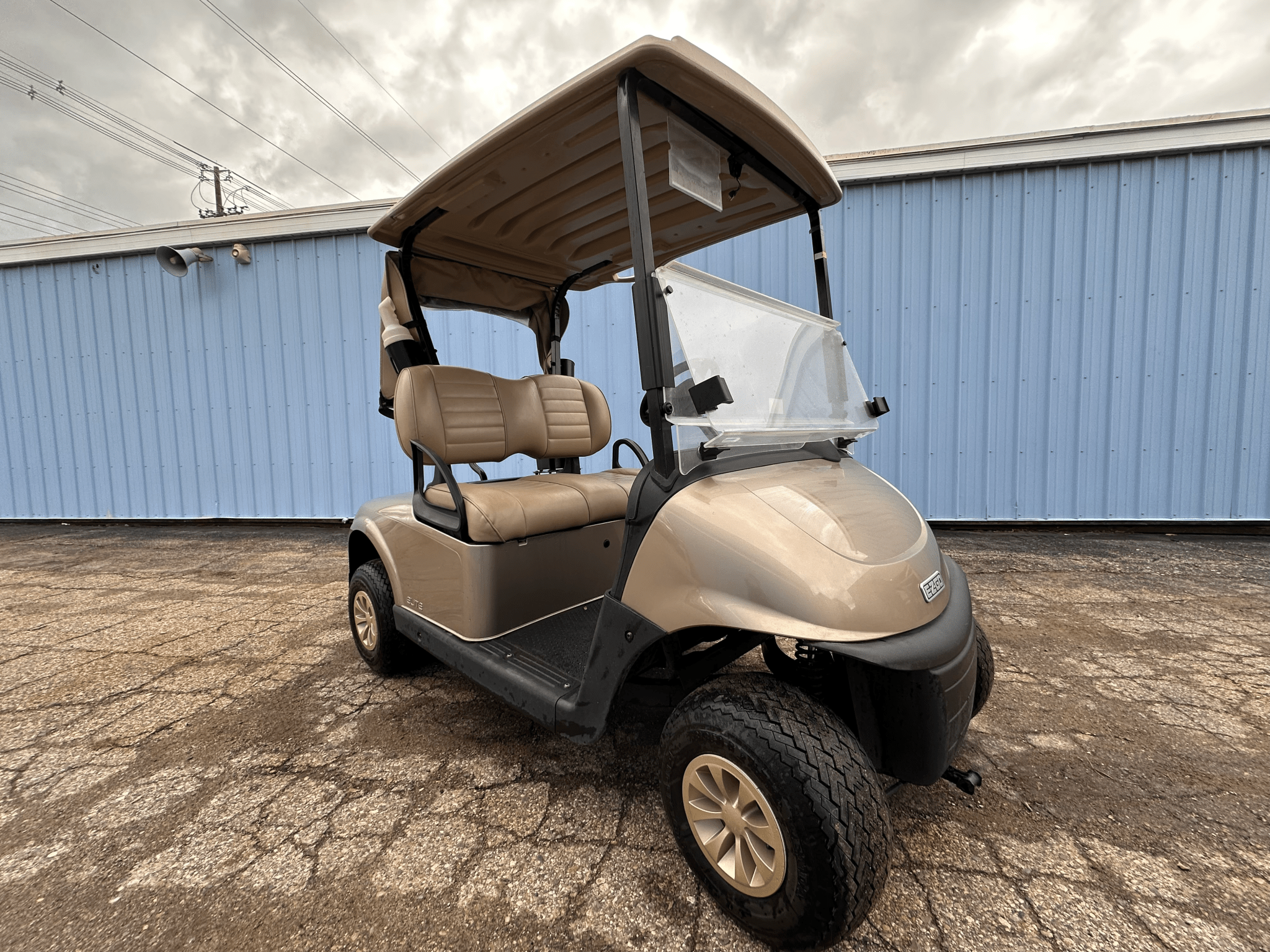 Arizona Beige EZGO Golf Cart with Rain Cover, Ball and Club Cleaner - Chief Cart Inc.