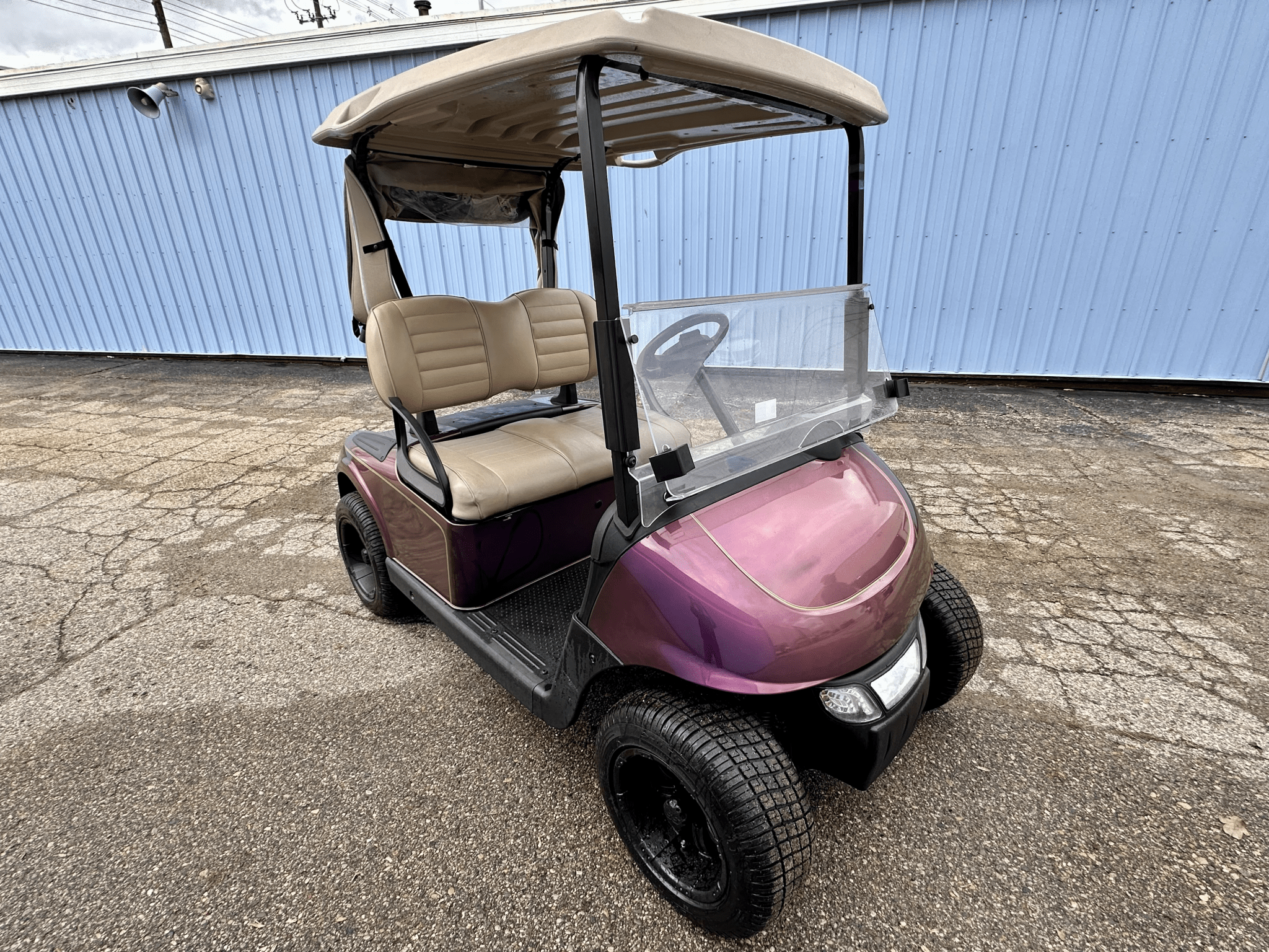 Burgundy EZGO Golf Cart with Rain Cover - Chief Cart Inc.