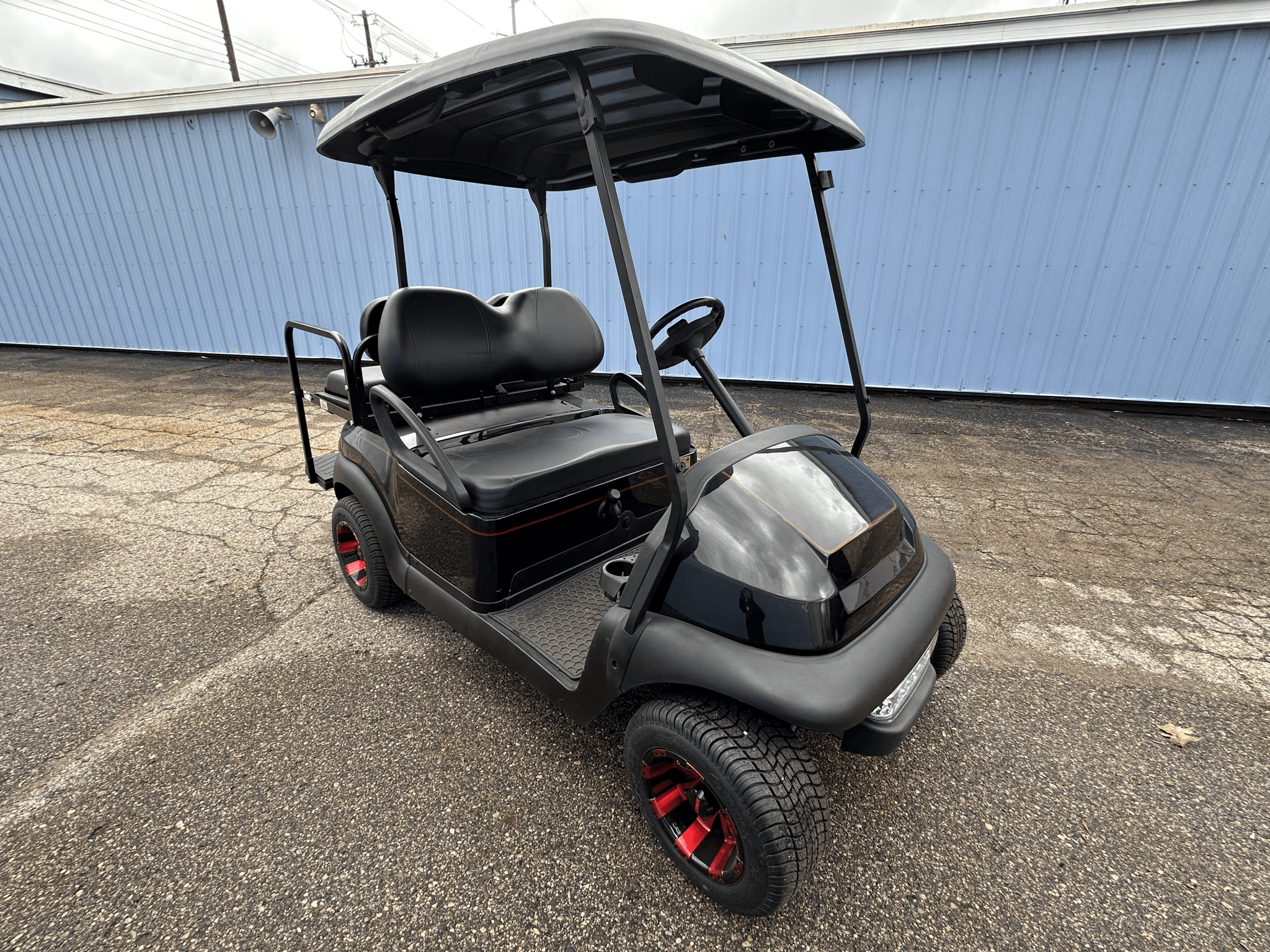Custom Black E - Z - GO Golf Cart with Red Rims | Custom Electric Golf Cart - Chief Cart Inc.